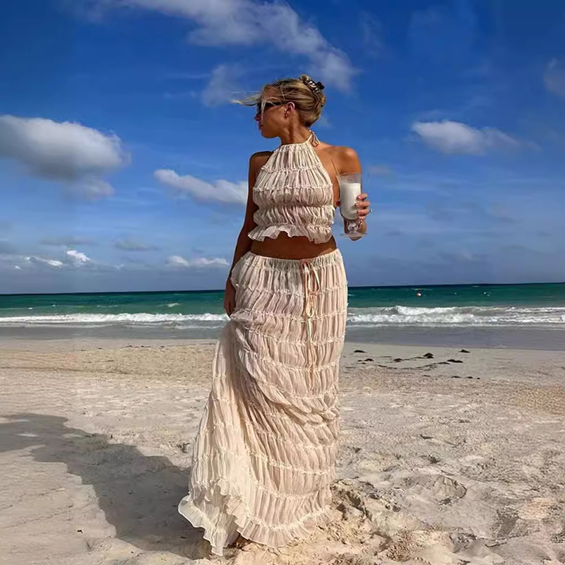 Women's matching halter-neck top and skirt two-piece outfit in a stylish summer design