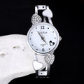 Silver wristwatch with heart designs on a black background
