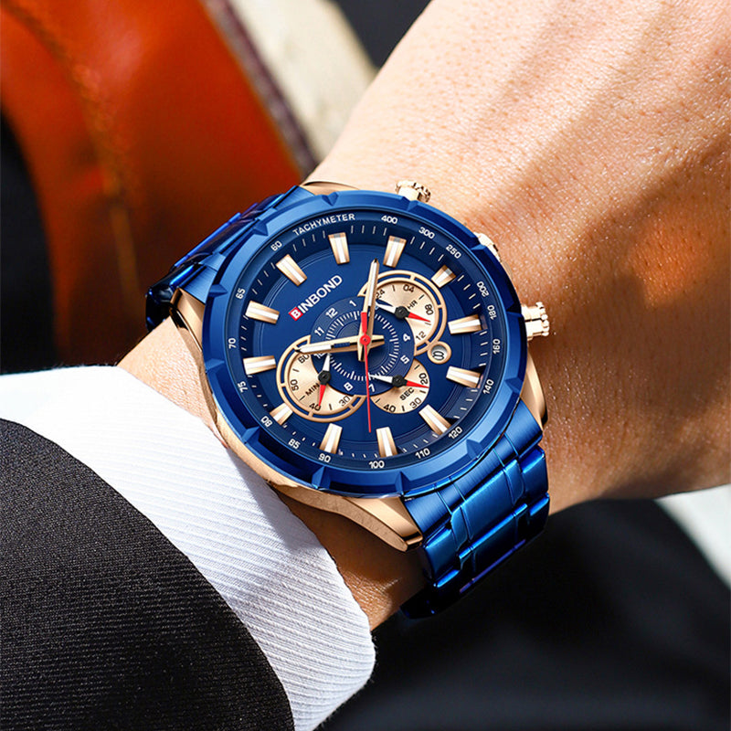 Blue watch with gold accents on a person's wrist