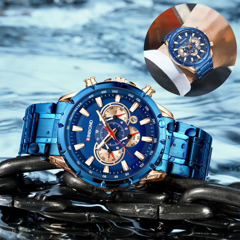 Blue and gold watch with detailed face on a water background