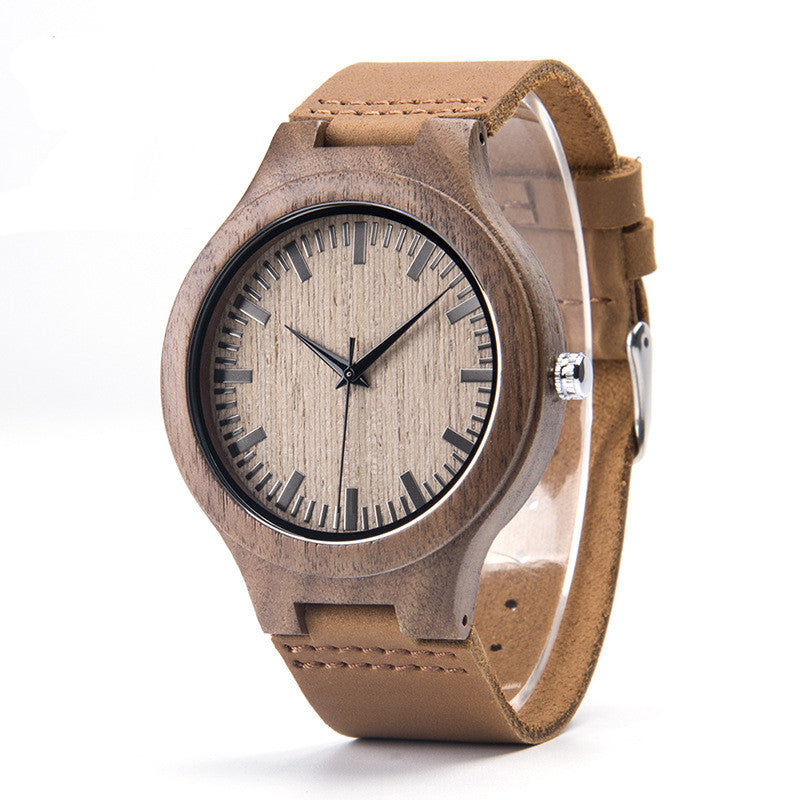 Wooden watch with a brown leather strap on a white background