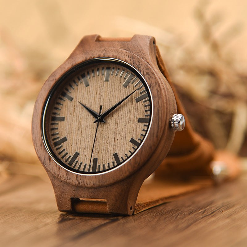 Wooden watch with black face on a wooden surface