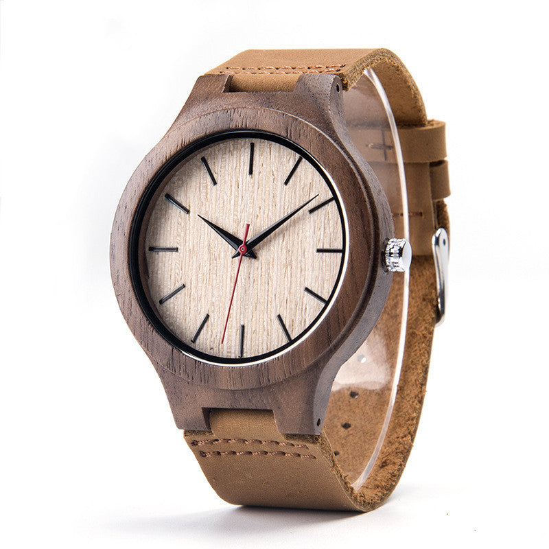 Wooden watch with a brown leather strap on a white background