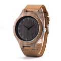 Wooden watch with brown leather strap on a white background