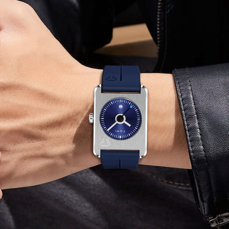 Wrist wearing a watch with a blue strap and silver case.