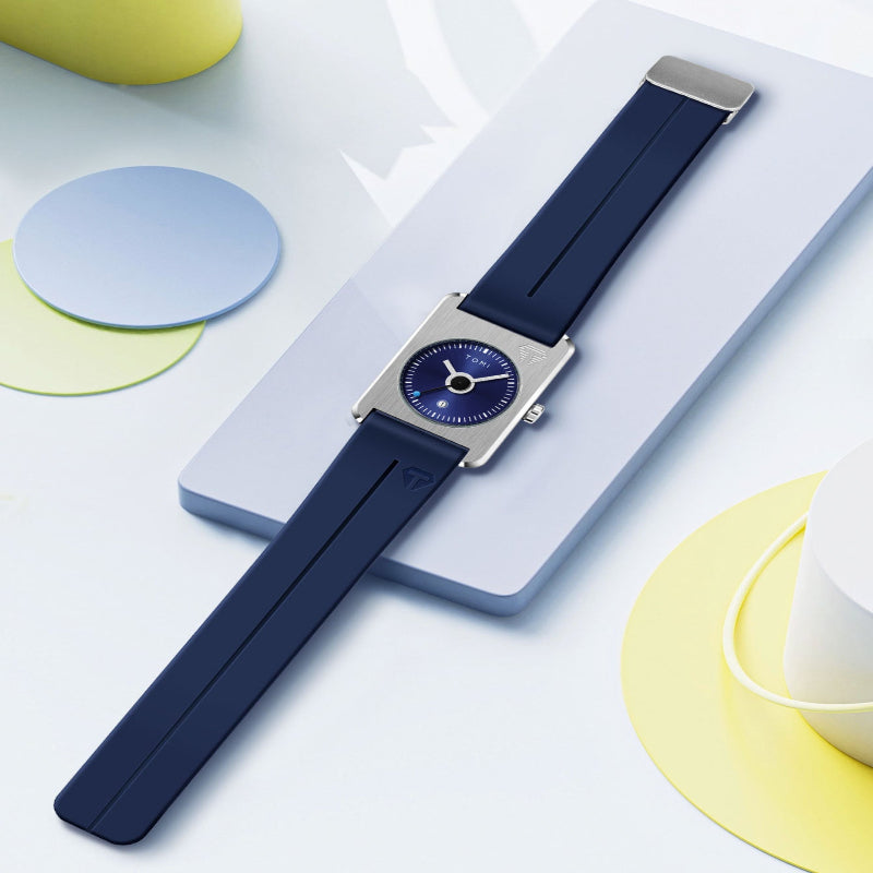 Watch with a blue strap on a light surface