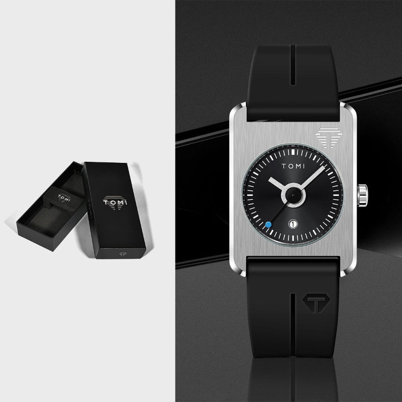 Black and silver watch with black strap and open black box on light gray background