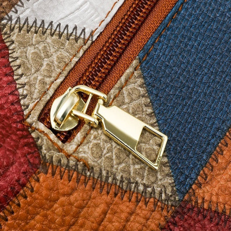 Close-up detail shot of a zipper pull on a patchwork quilted fabric bag. The image includes text labels reading 'Detailed display' and 'DETAIL SHOW' with 'Minimalist zipper' and 'Smooth opening and closing, no sticking, easy to store.