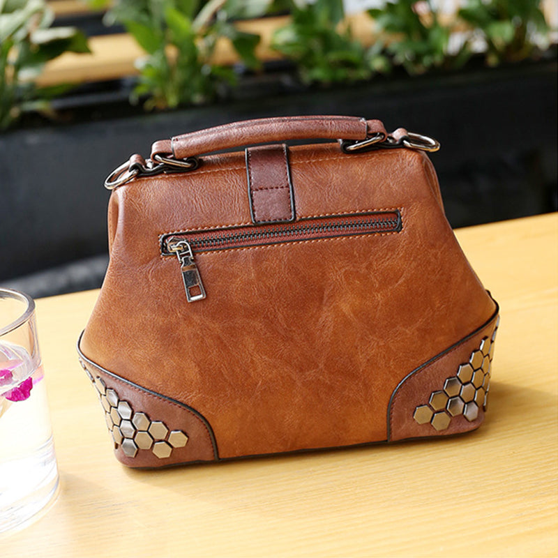 Brown leather handbag with hexagonal patterns