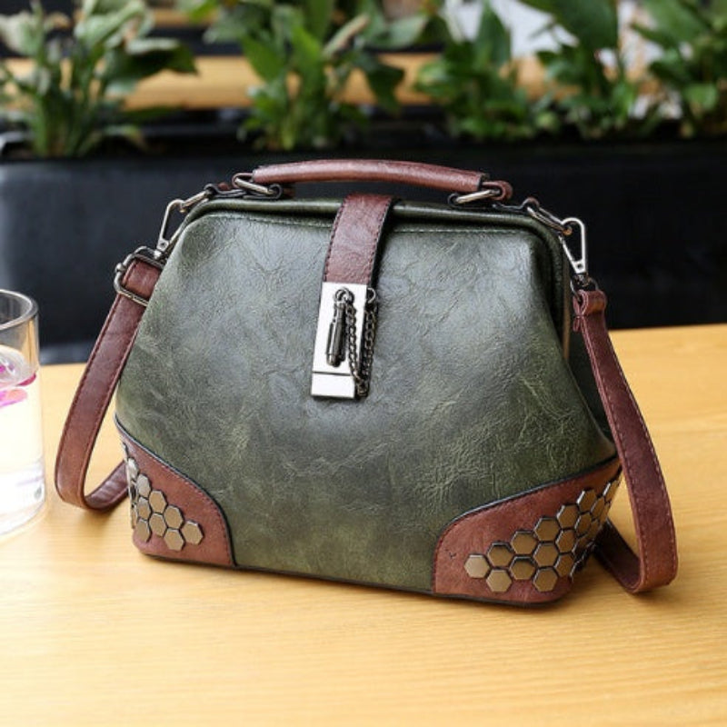 Green handbag with brown accents