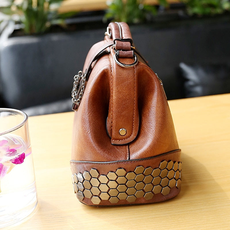 Brown leather handbag with honeycomb pattern